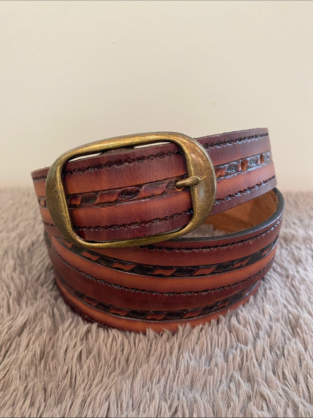 Vintage brown tooled leather belt 47” long 1.5” wide brass